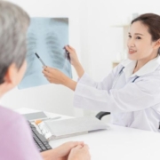 Doctor showing lung x-ray result to patient