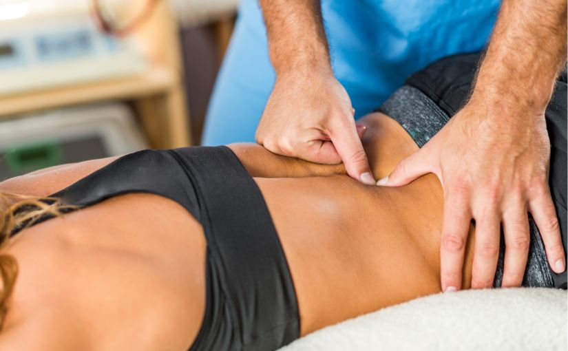 chiropractic doctor doing spinal manipulation on patient